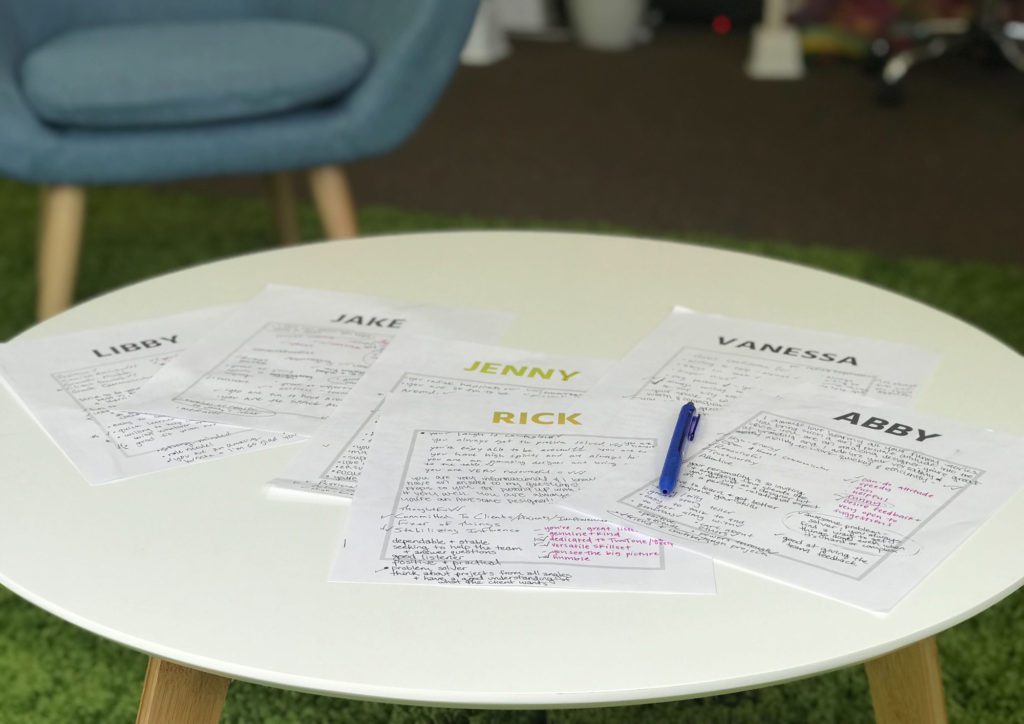 Team strengths activity sheets on coffee table
