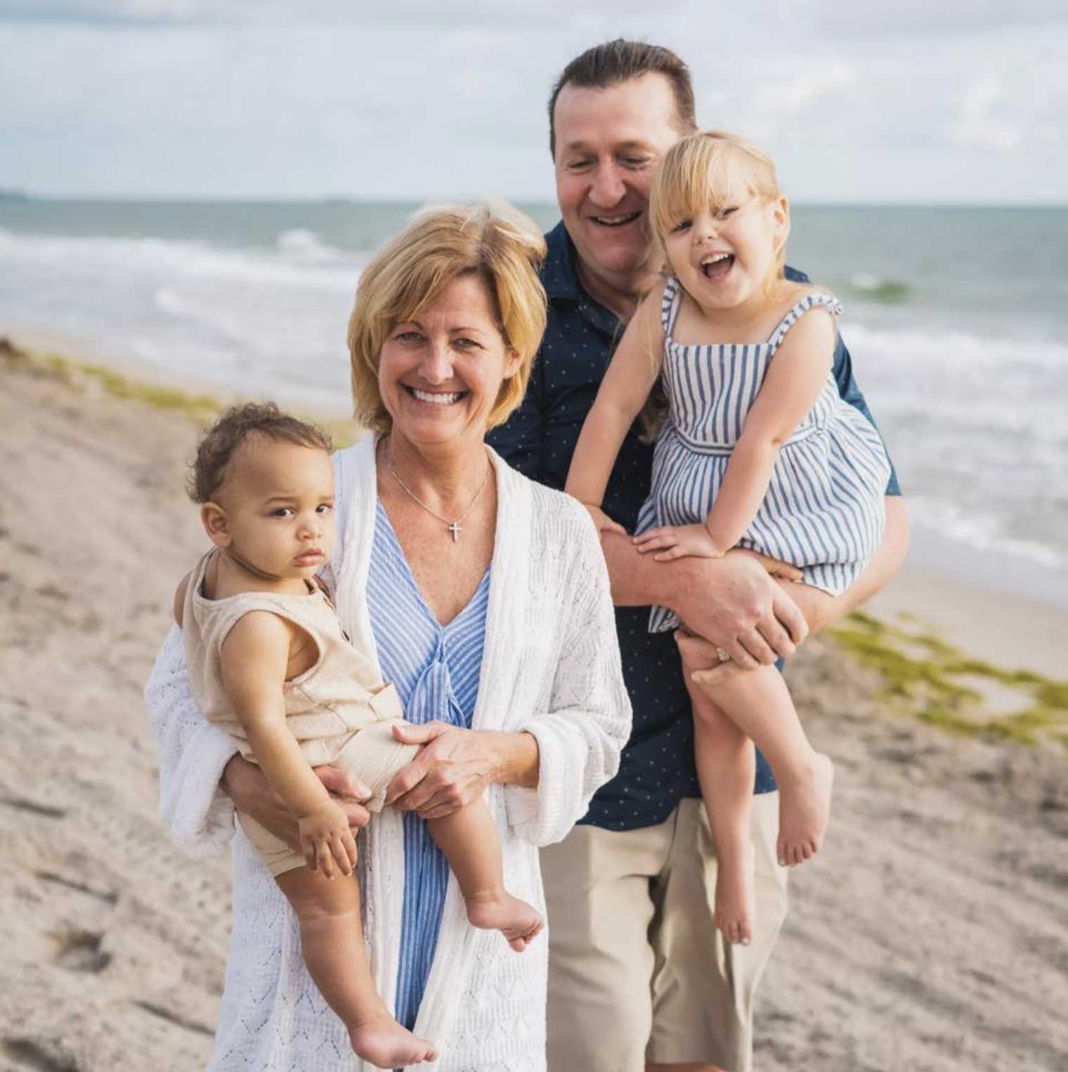 Kim McClintic with her family at the beach, devoted grandma and four grandkids.