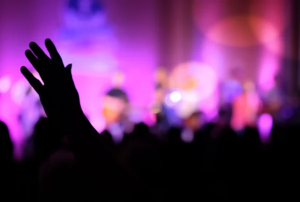Raised hands and worship band during fall ministry kickoff.