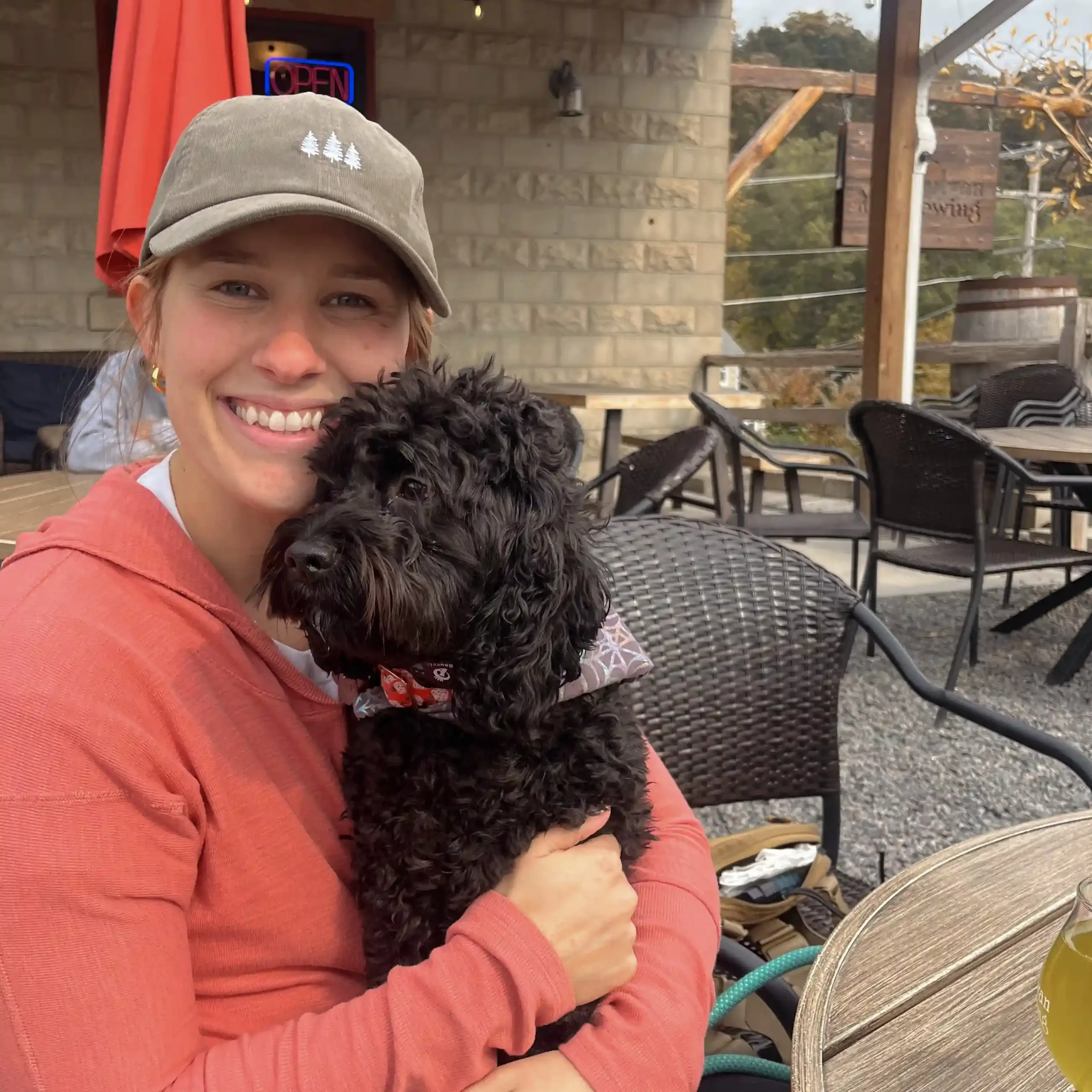 Molly Unick and her dog, illustrating an active and inspired lifestyle.