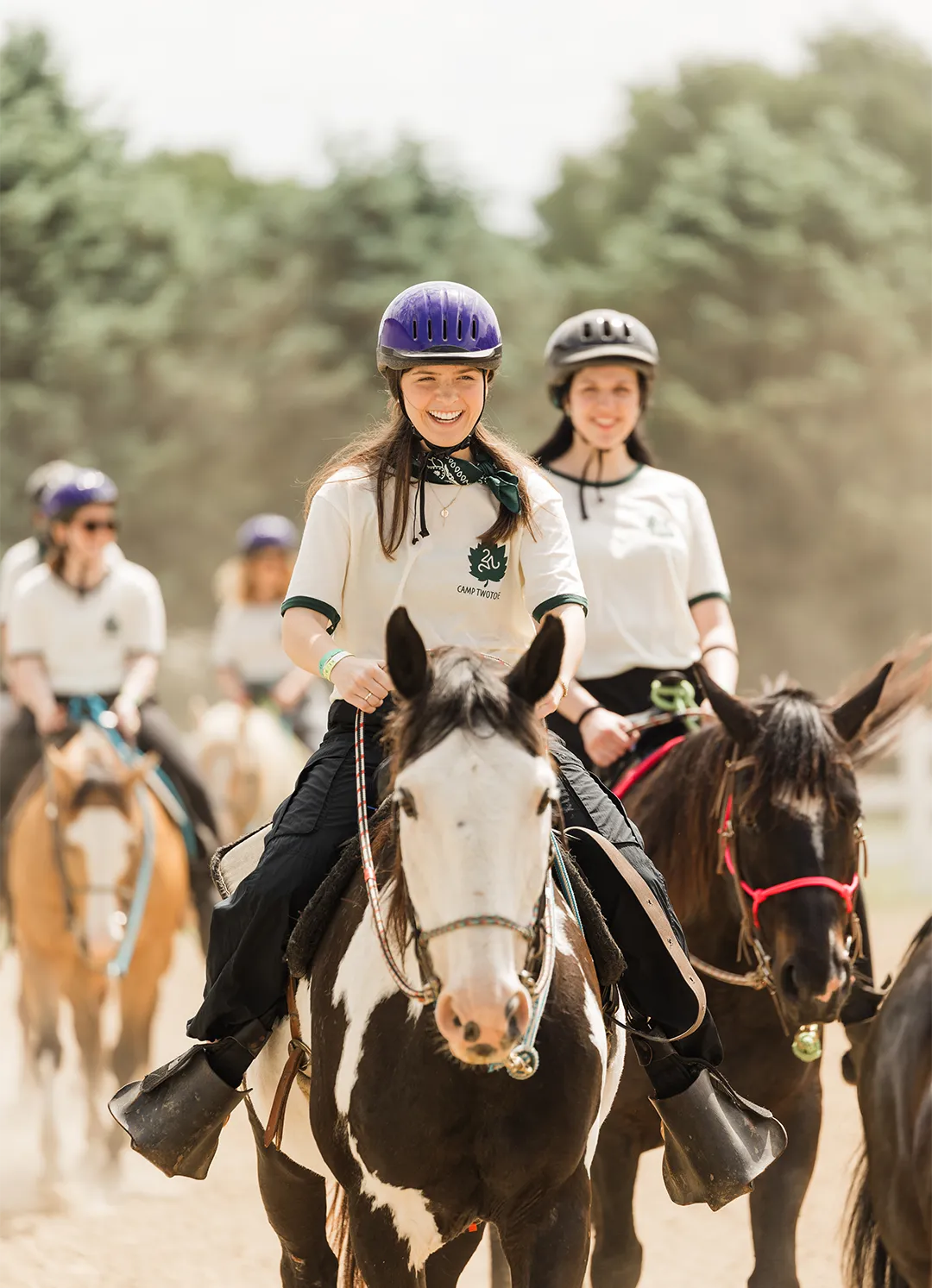 TwoTone Creative team members horseback riding, illustrating a remarkable and relational company culture.