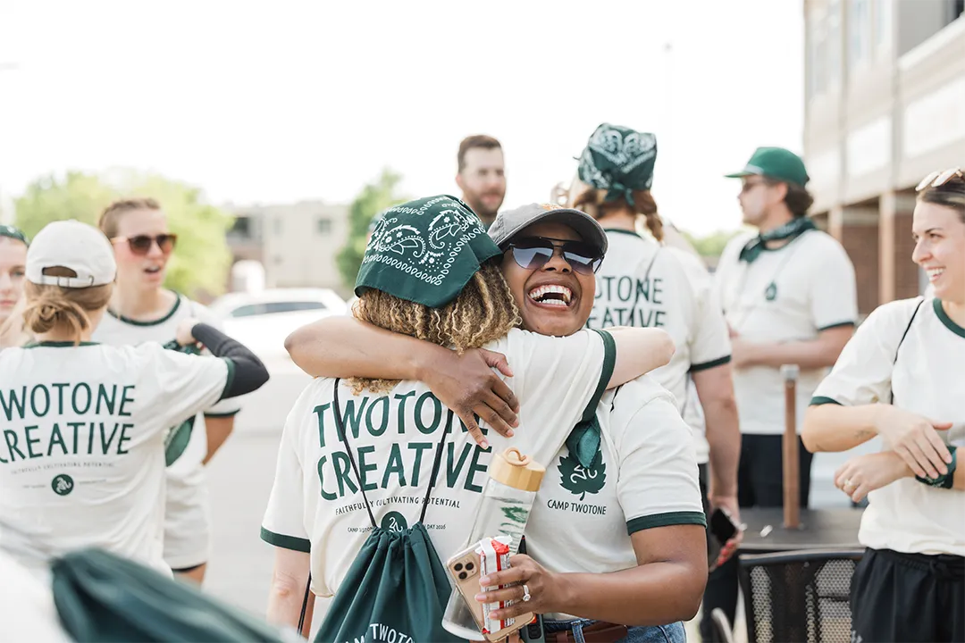 TwoTone Creative team members celebrating and connecting during a team-building event.