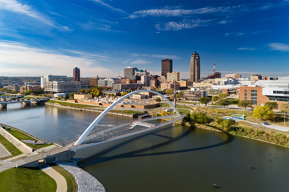 Aerial view of Des Moines, Iowa skyline and iconic bridge, showcasing communities TwoTone Creative serves.