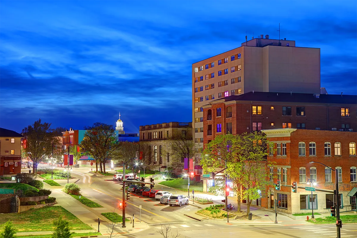 Iowa City cityscape at dusk, University of Iowa buildings and downtown area.