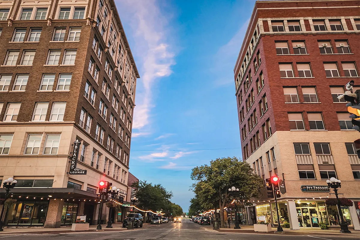 Waterloo Iowa cityscape and historic architecture along a revitalized riverfront.
