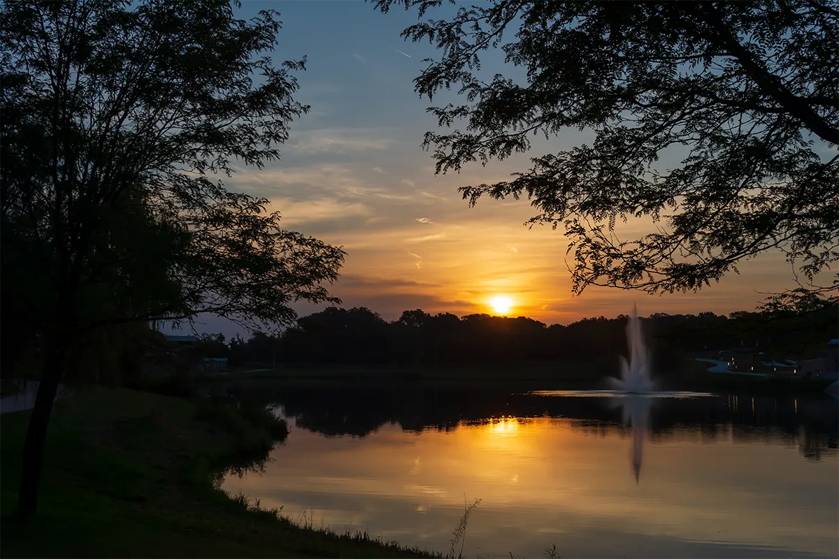 West Des Moines Iowa sunset over a lake and fountain
