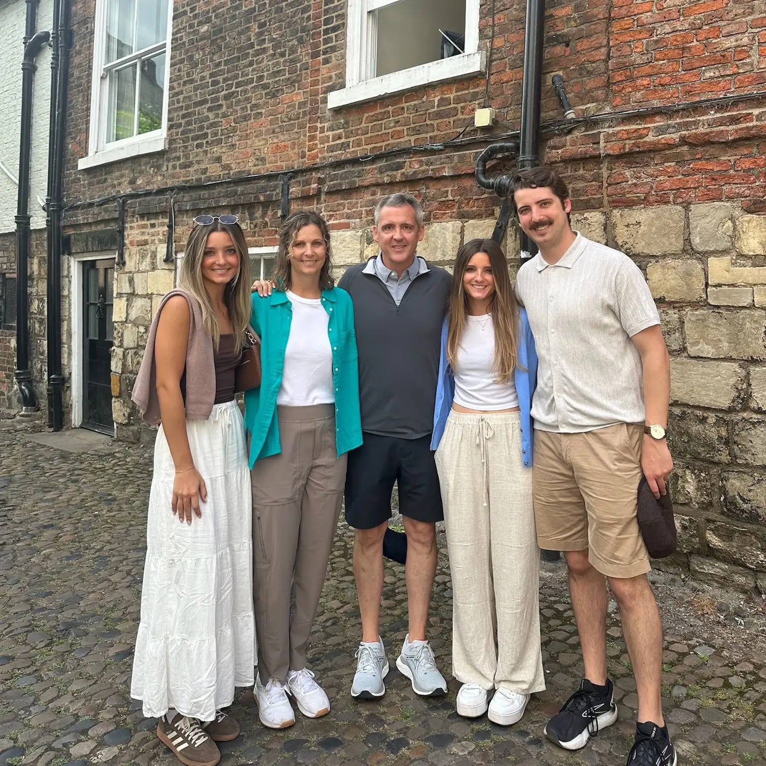 Cameron Blom and family portrait, outdoor setting reflecting personal interests.