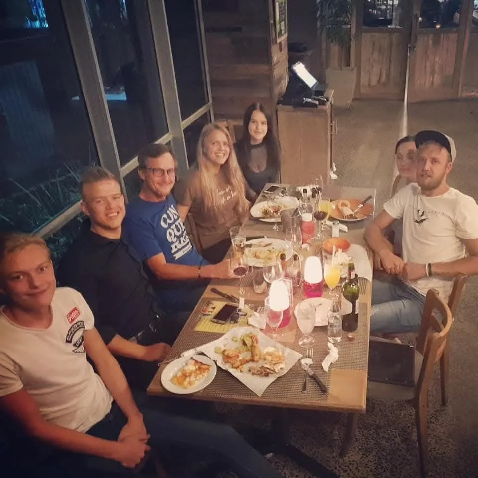 Hannah Barnard with TwoTone Creative team enjoying a dinner gathering.