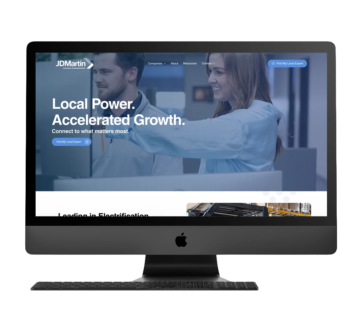 JDMartin website design on computer screen showcasing accelerated growth and local power.
