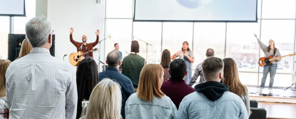 Church worship service with band and audience, TwoTone Creative marketing for churches.
